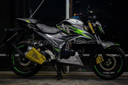Side view of a motorcycle displaying the Gixxer FI XX Decal Set with green and yellow graphics on a black and silver body.
