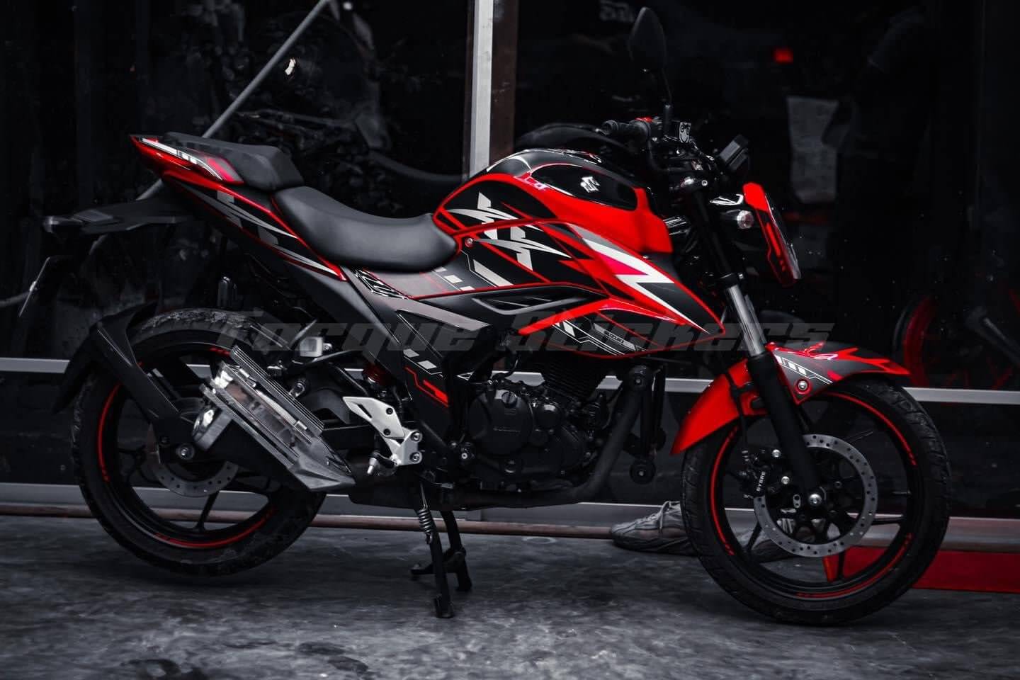 Gixxer FI XX Decal Set: Red and black motorcycle with striking decals, parked in dark setting, showcased on product page.