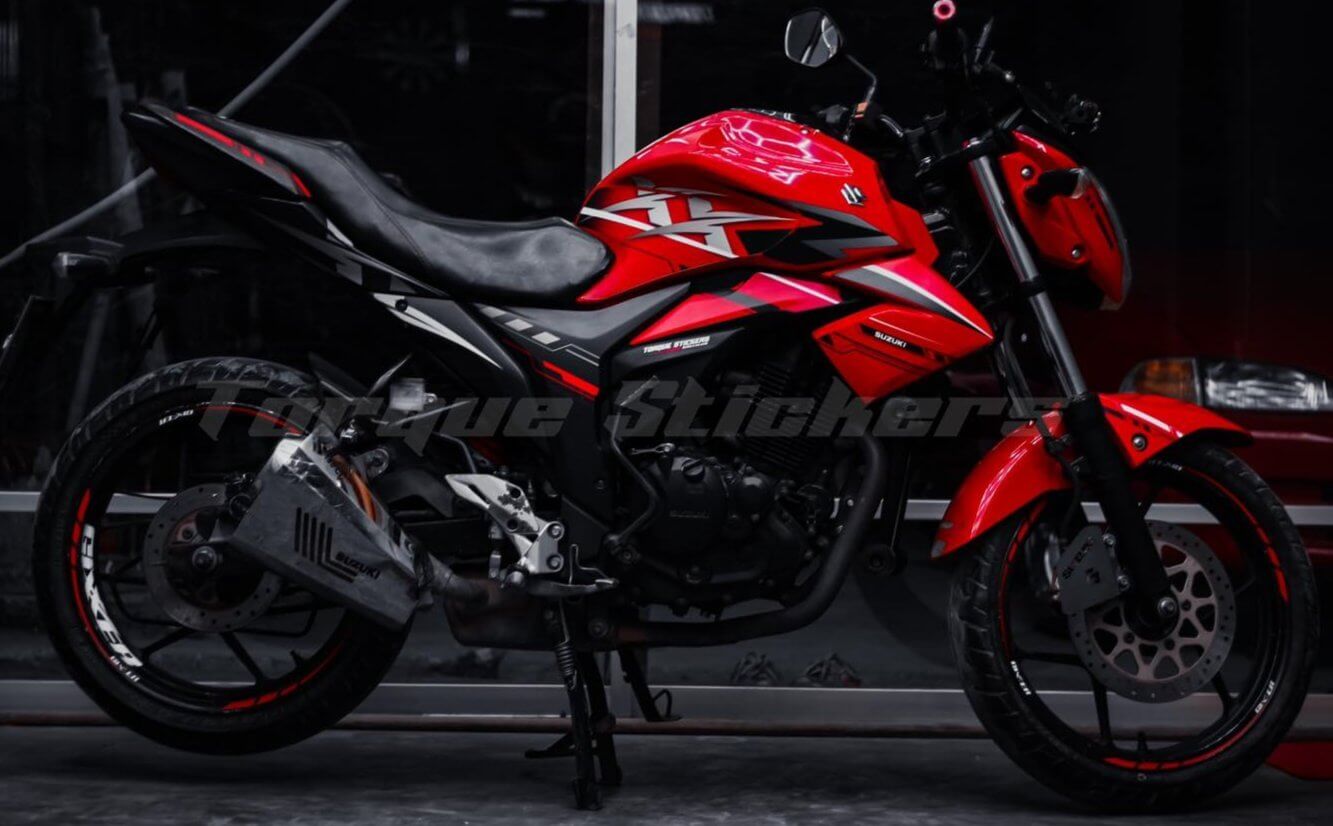 A GIXXER motorcycle showcasing the Monotone XX decal set, featuring red and black graphics on a sleek design.