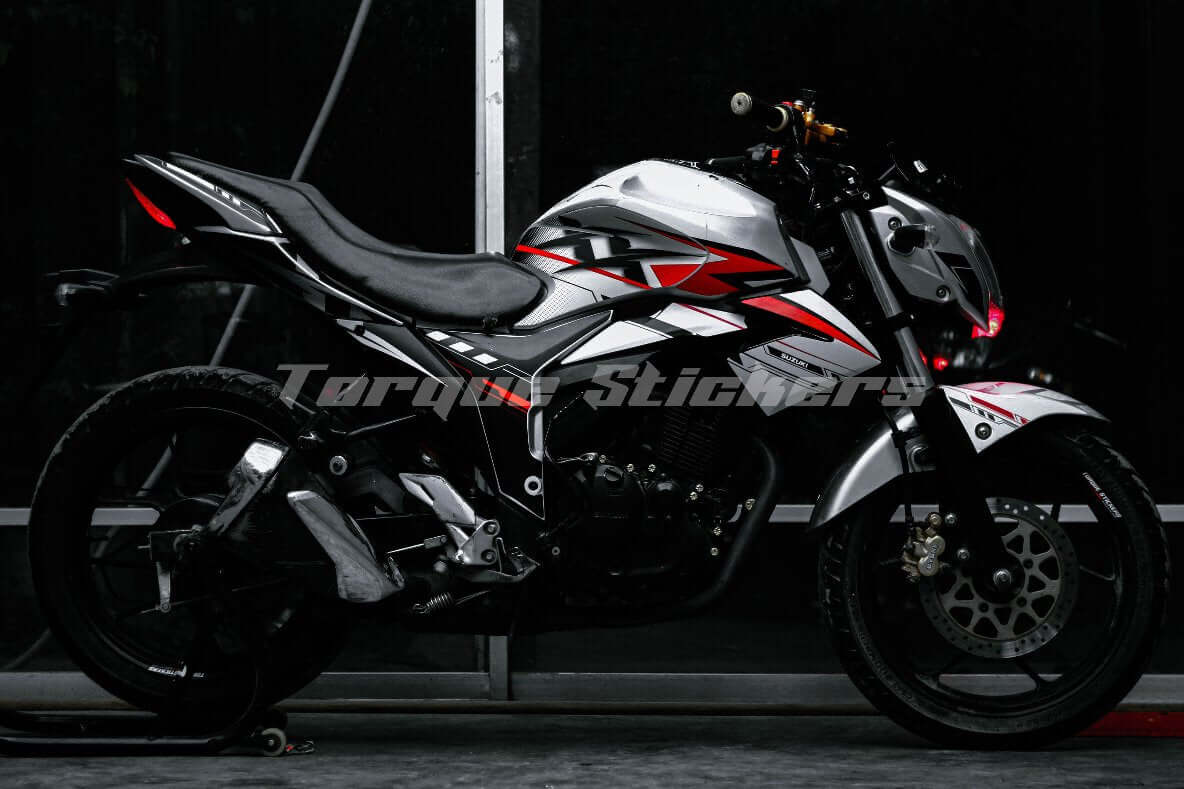 Side profile of a motorcycle featuring the GIXXER MONOTONE XX DECAL SET, highlighting sleek design and vibrant red accents.