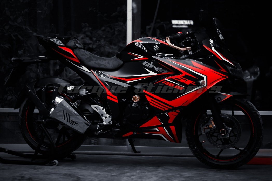 Gixxer SF Sporty Decal on a sleek black and red motorcycle, showcasing dynamic design and vibrant graphics in a dark setting.