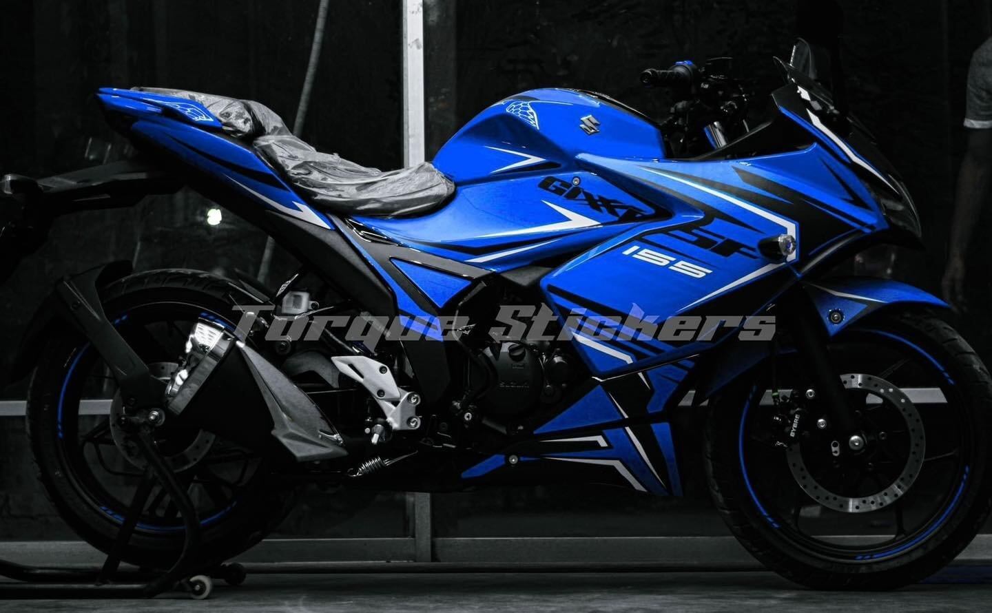 Blue Gixxer SF motorcycle with sporty decals, displayed on the product page for Torque Stickers.